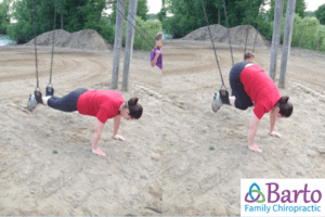 Knee tucks on playground swing